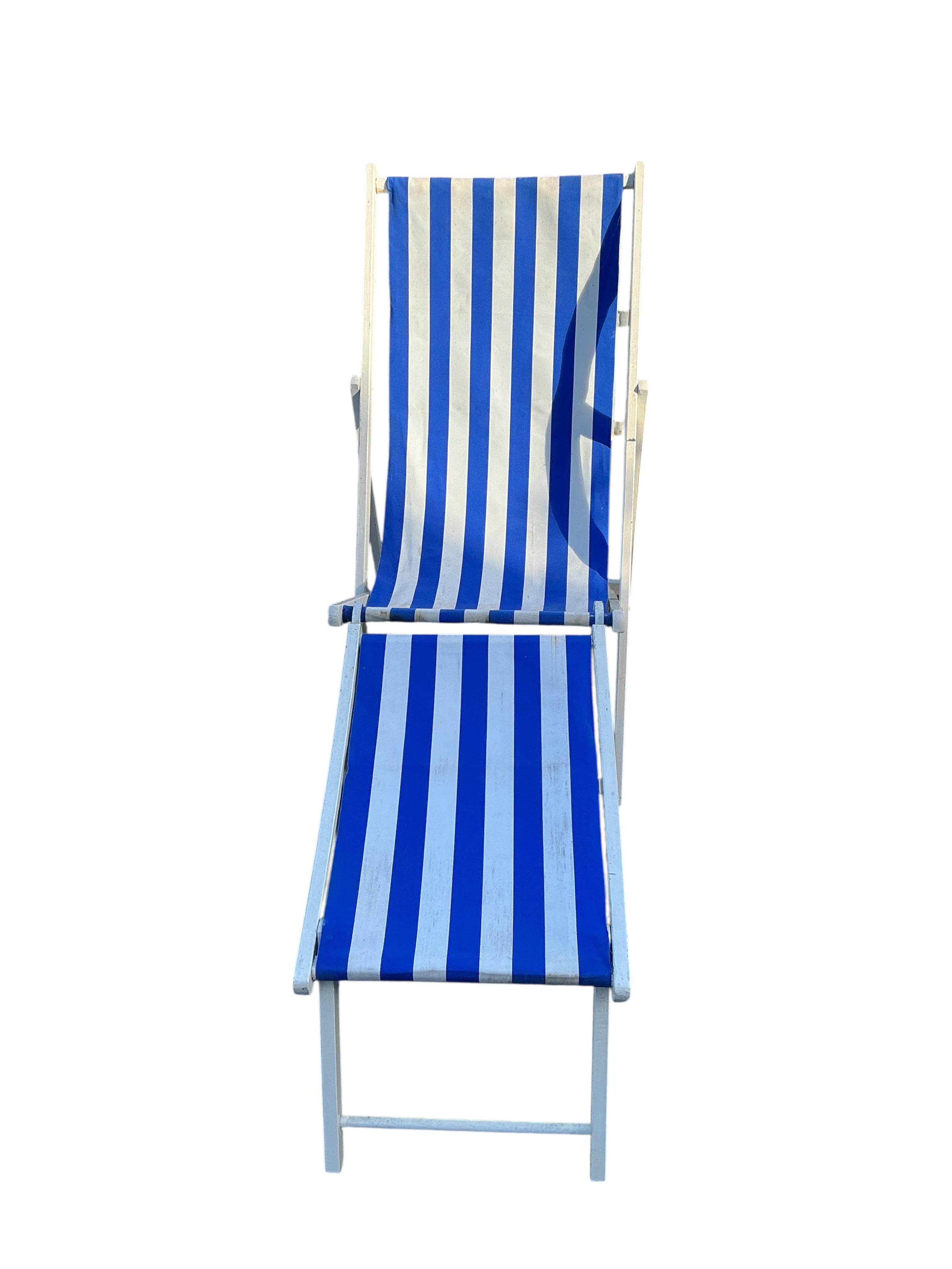 A set of four early 20th century deck chairs, two with footrests and two with sun shades